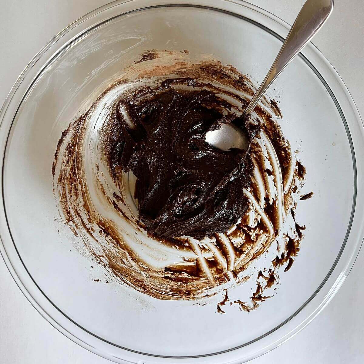 Wet ingredients for carob dough in a glass bowl.