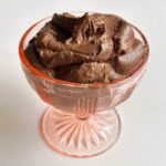 High protein chocolate mousse in a vintage glass dish.