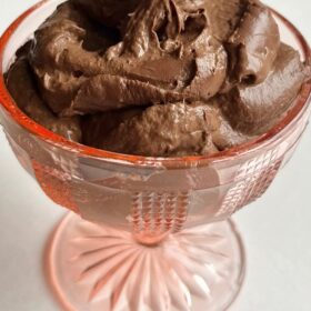 Chocolate mousse in a vintage glass dish.