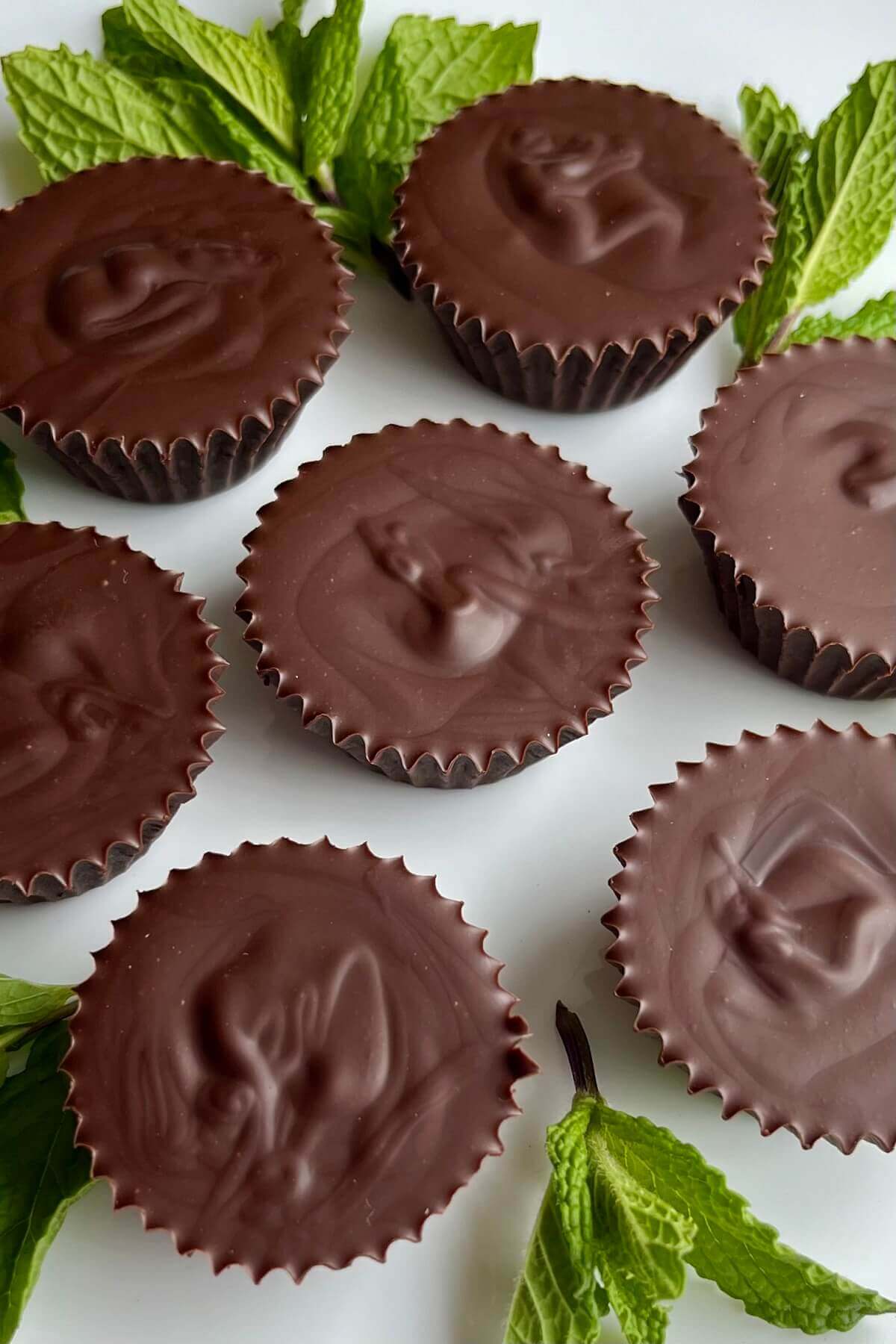 Vegan mint truffles on a white plate.