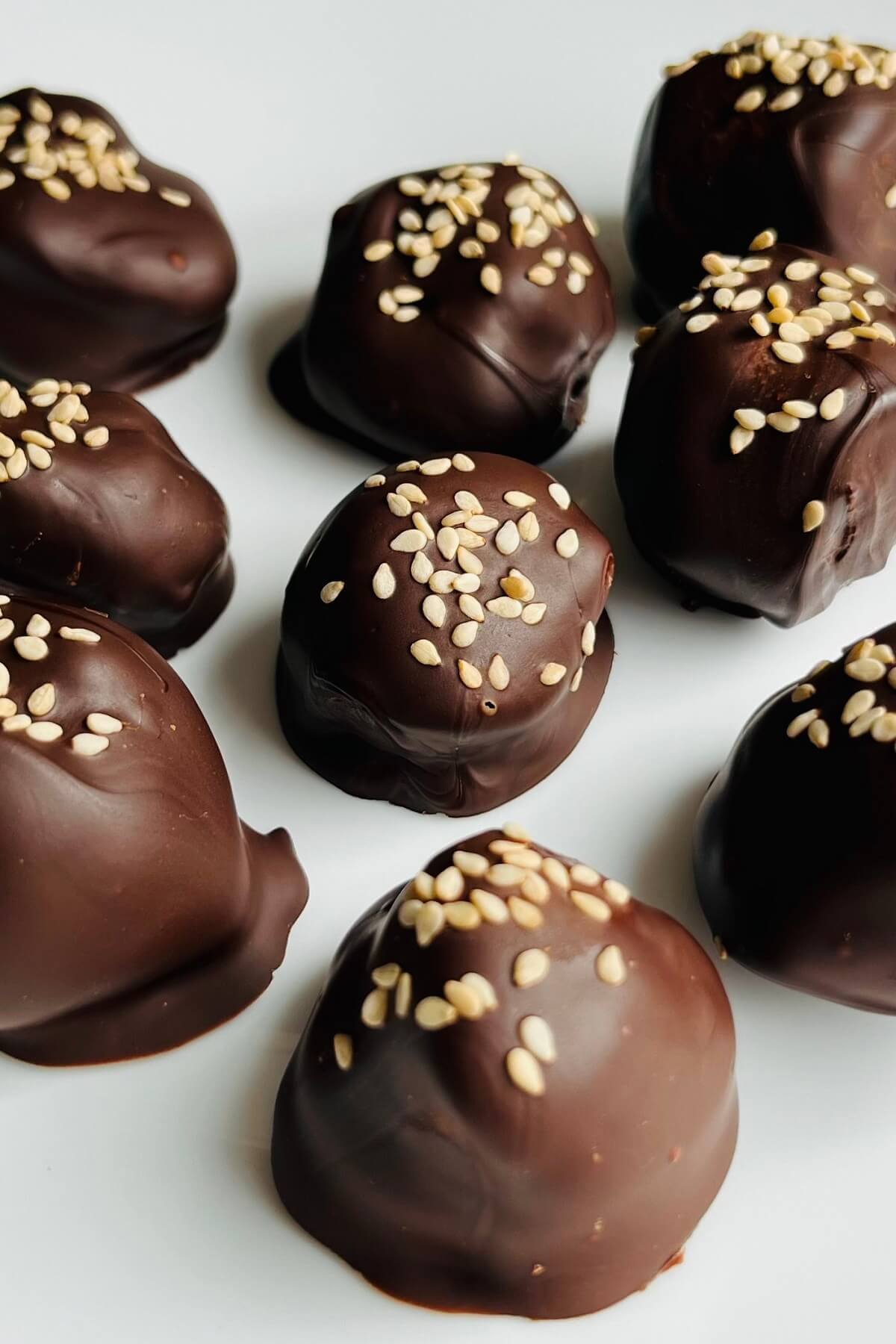 Tahini chocolate truffles on a plate.