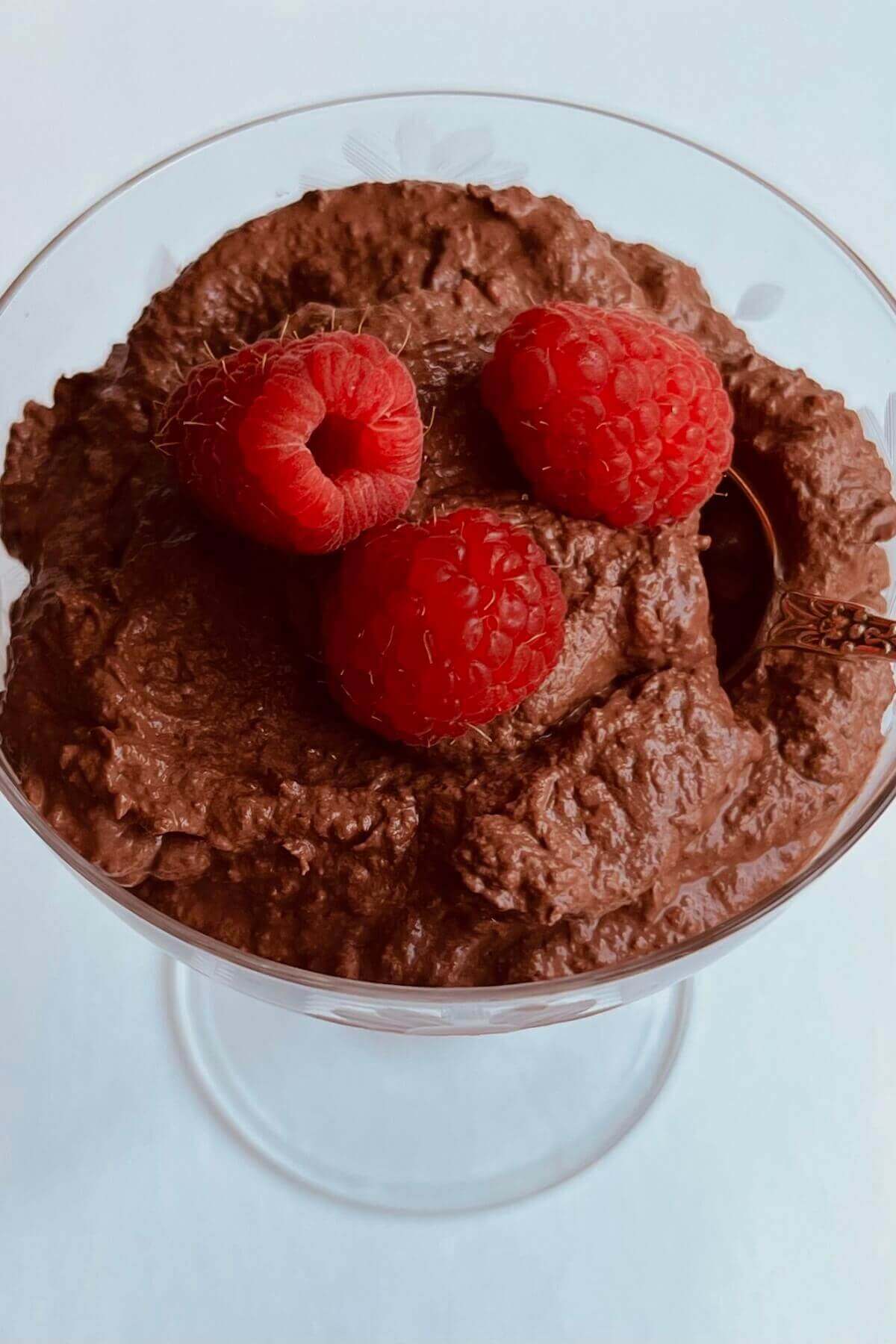 Dark chocolate and raspberry mousse in a glass dish.