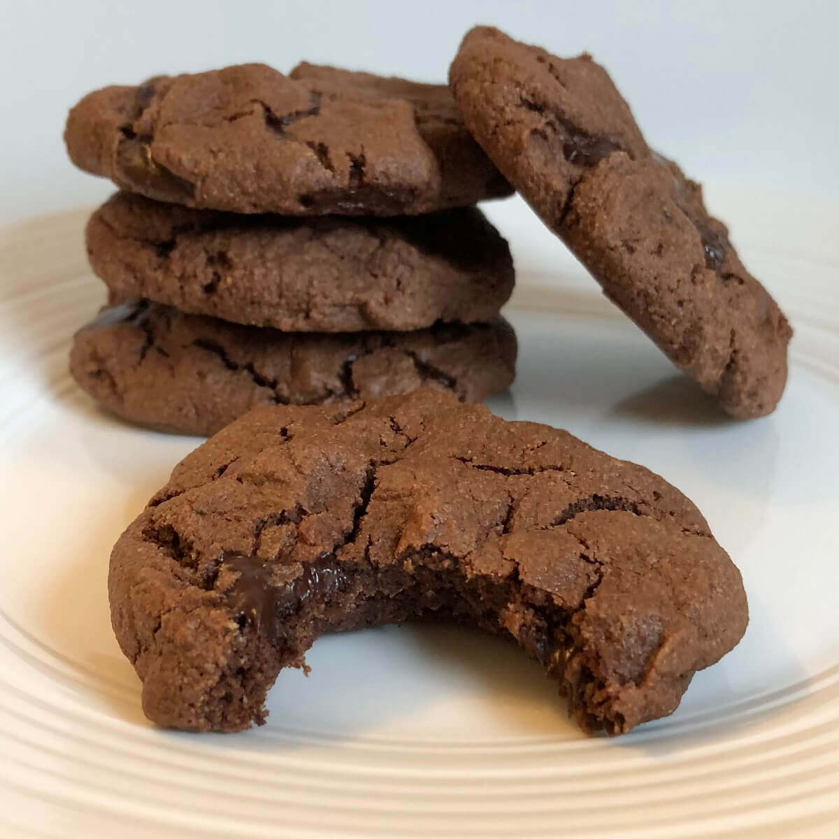 Chocolaty paleo cookies on a white plate.