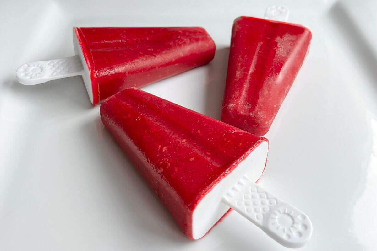 Homemade popsicles on a white plate.