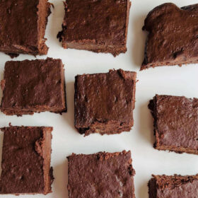 Vegan banana brownies on a white platter.
