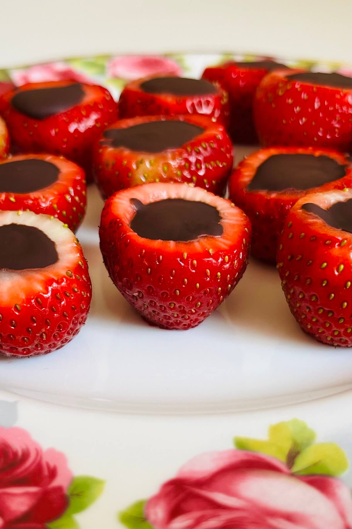 Chocolate stuffed strawberries on a plate.