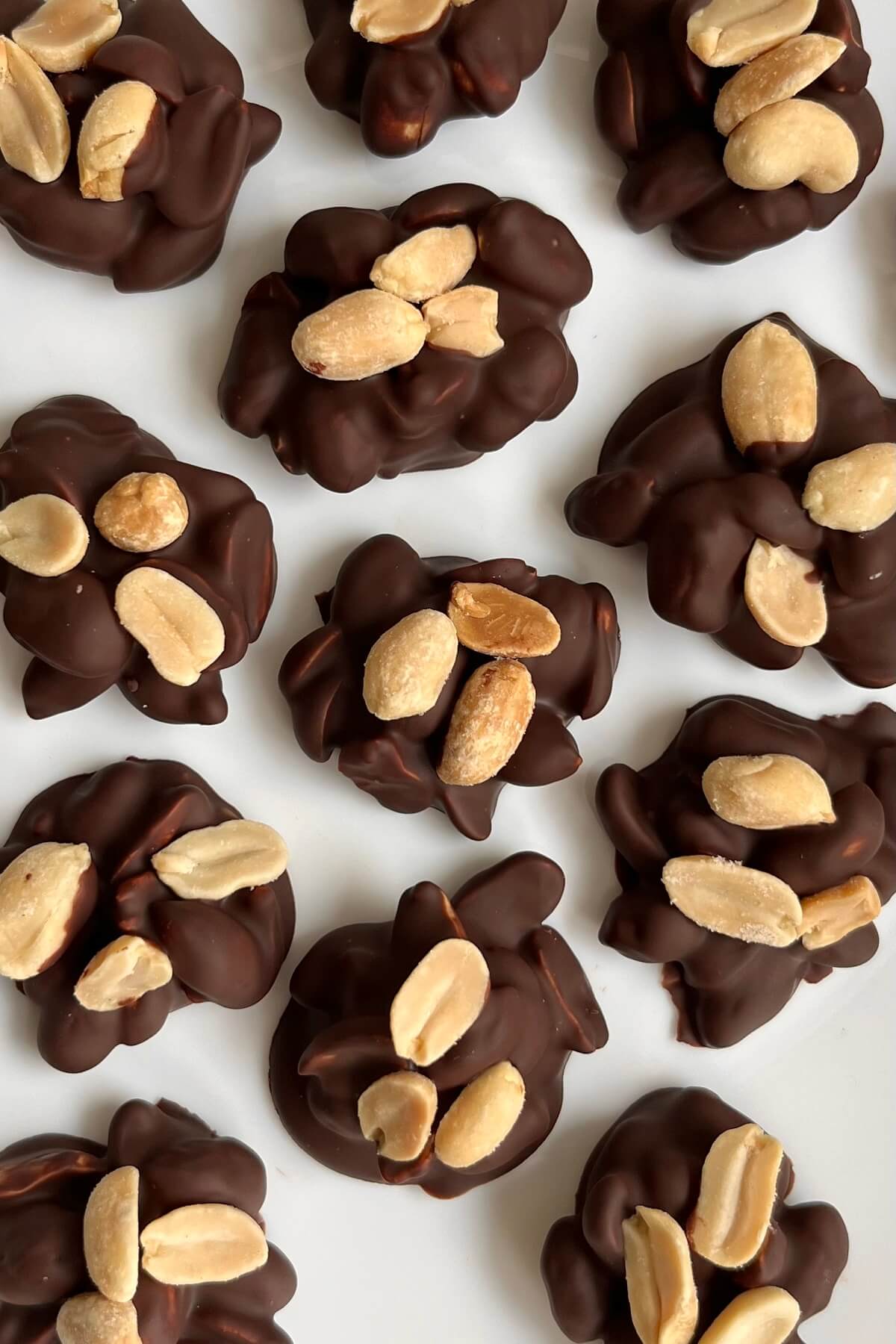 Chocolate peanut bites on a white plate.