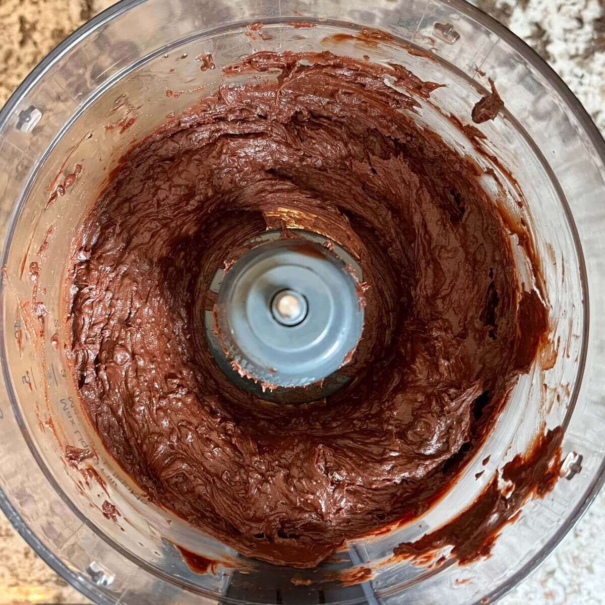 Blended ingredients for fudge in a food processor.