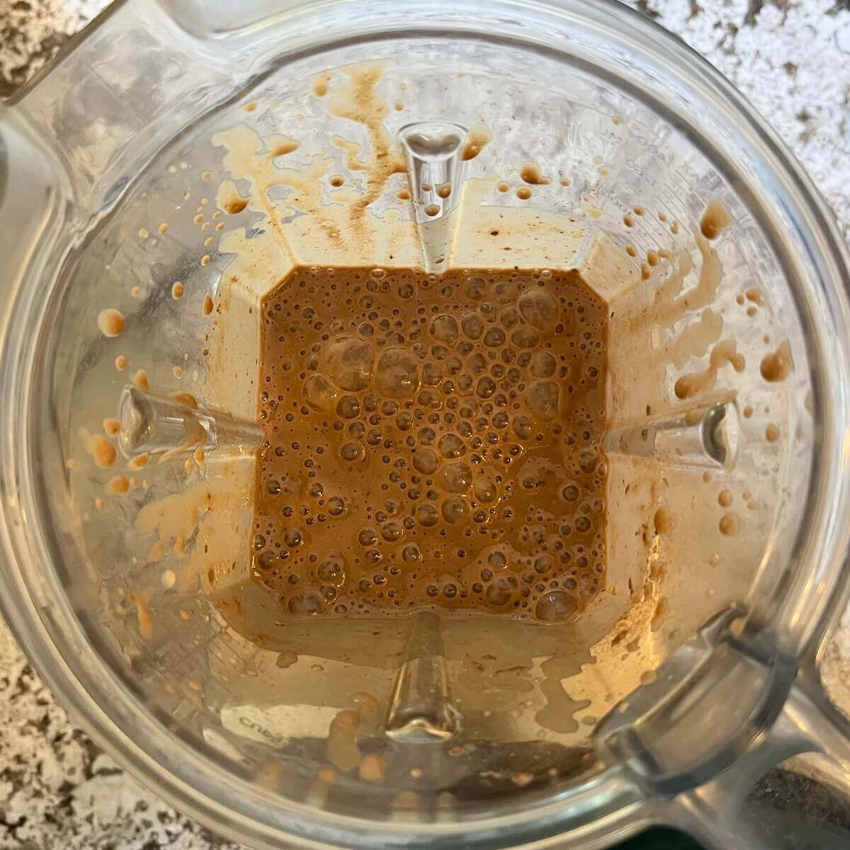 A blended smoothie made with beans in a blender.