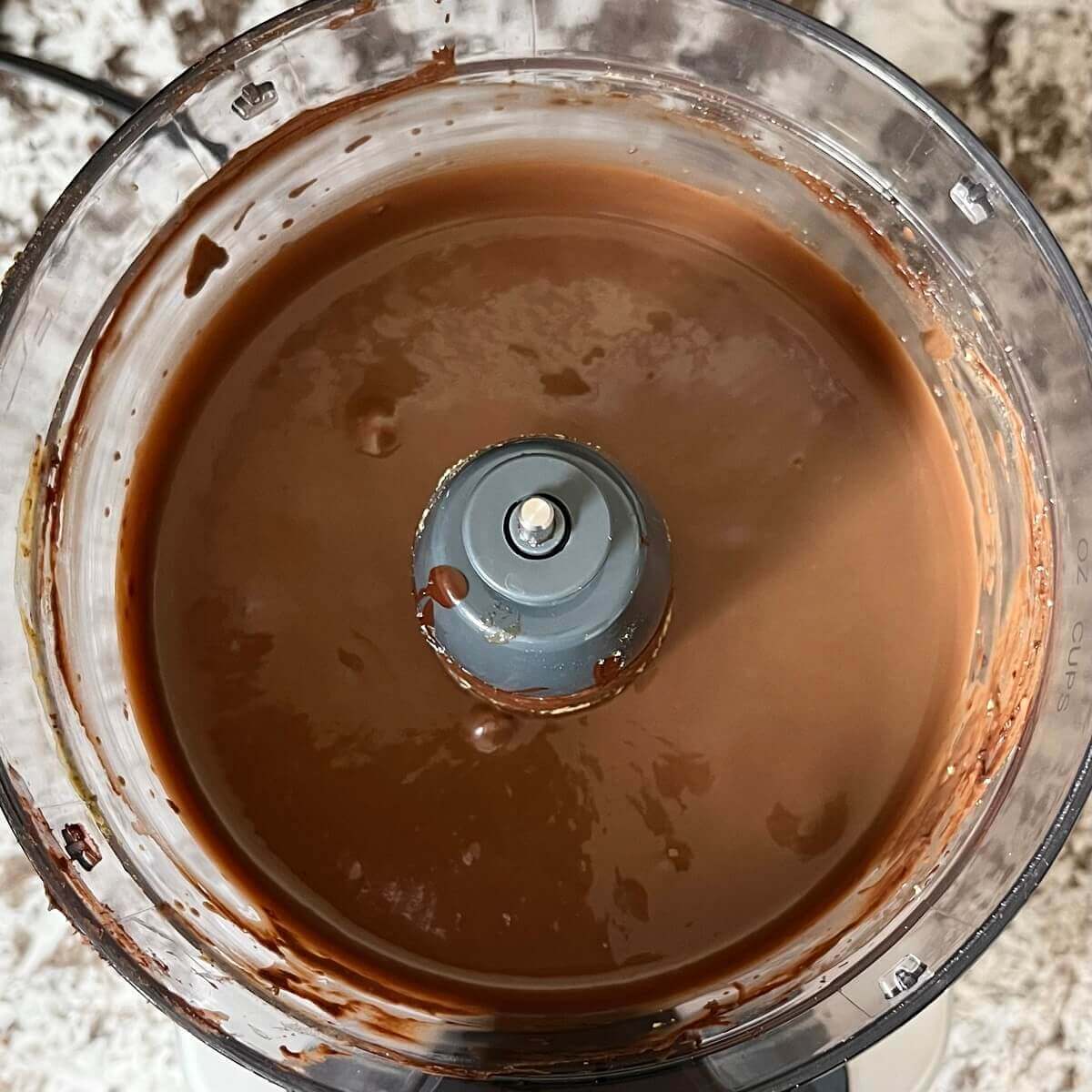 Vegan chocolate pudding blended in a food processor.