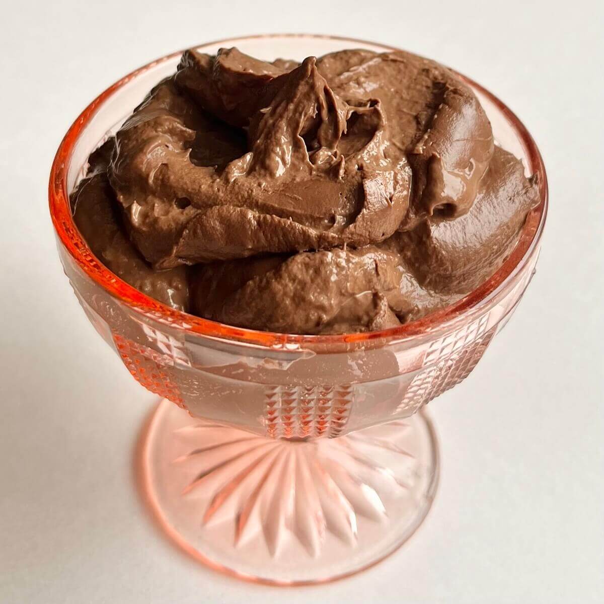Vegan high protein pudding in a glass dish.