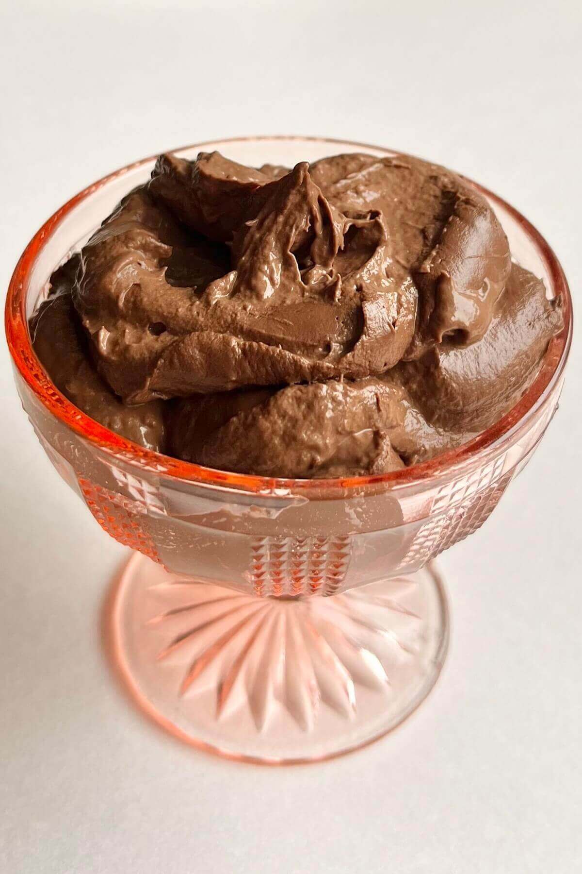 Chocolate protein pudding in a glass dish.