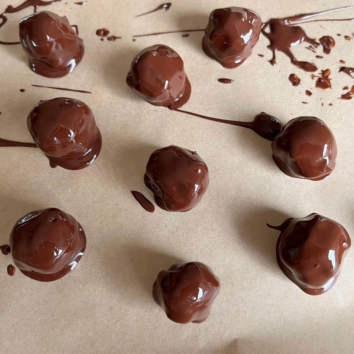 Mocha balls covered in wet melted chocolate.