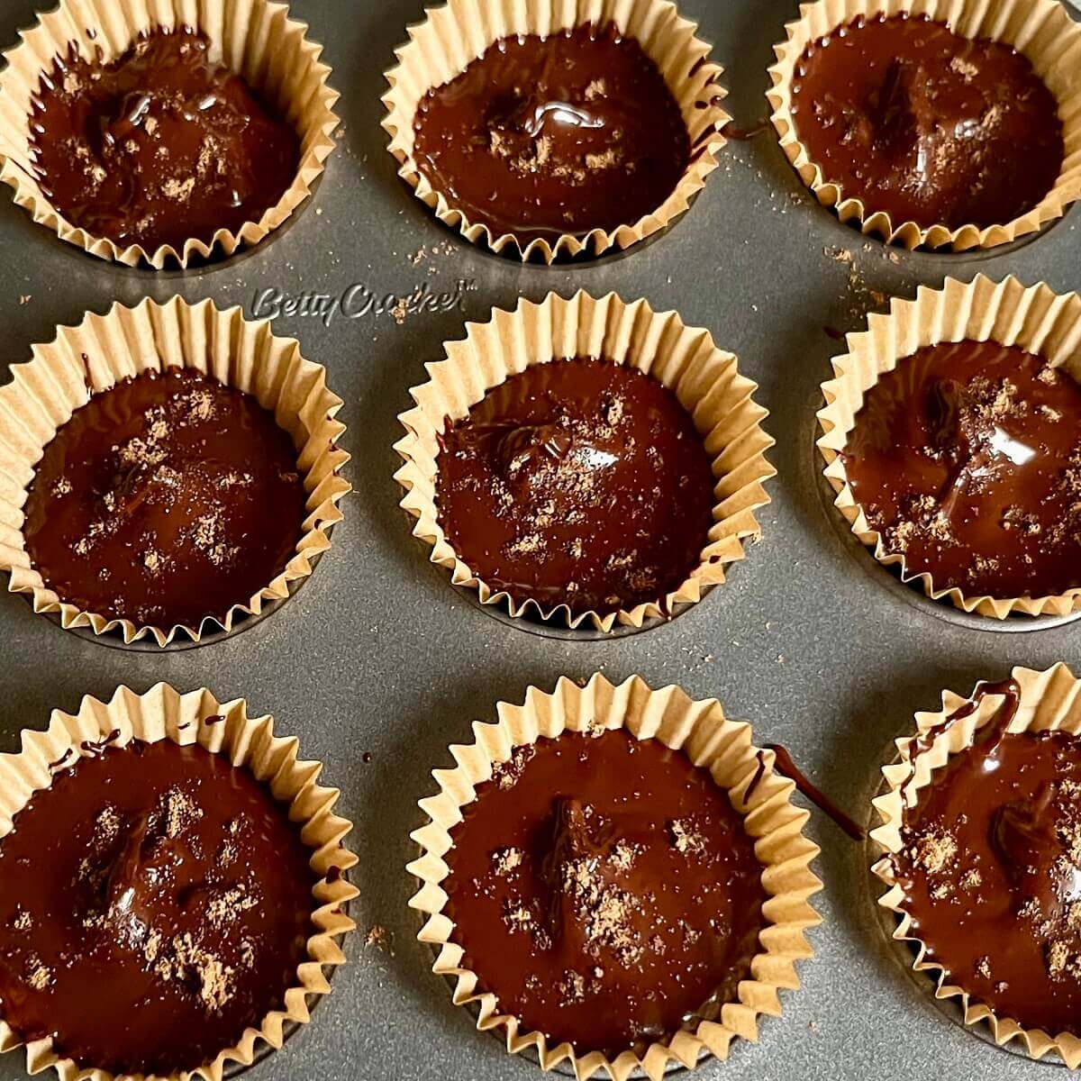 Gingerbread chocolate treats in a mini muffin pan.