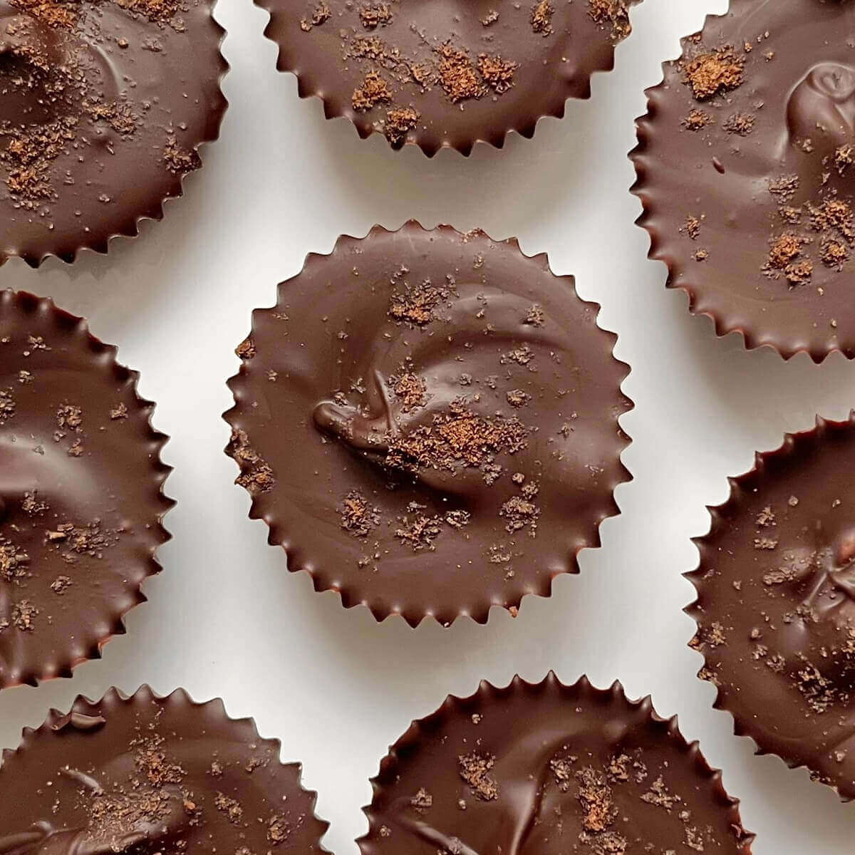 Gingerbread chocolates on a white plate.
