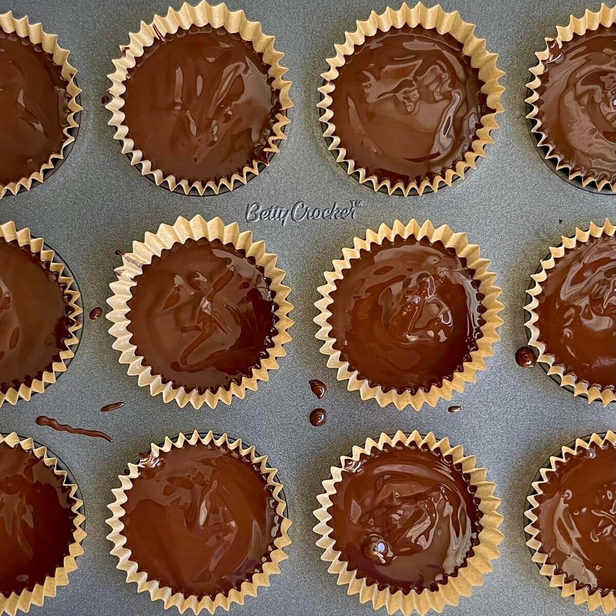 Sunflower butter cups in a mini muffin pan.
