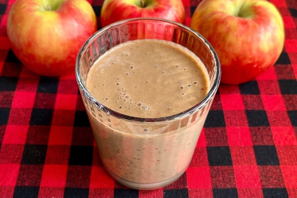 An apple protein shake in a glass.