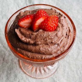 Black bean chocolate mousse in a glass dish.