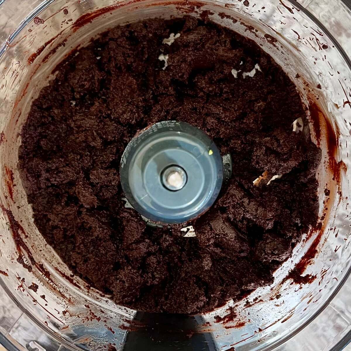 Avocado and melted chocolate blended in a food processor.