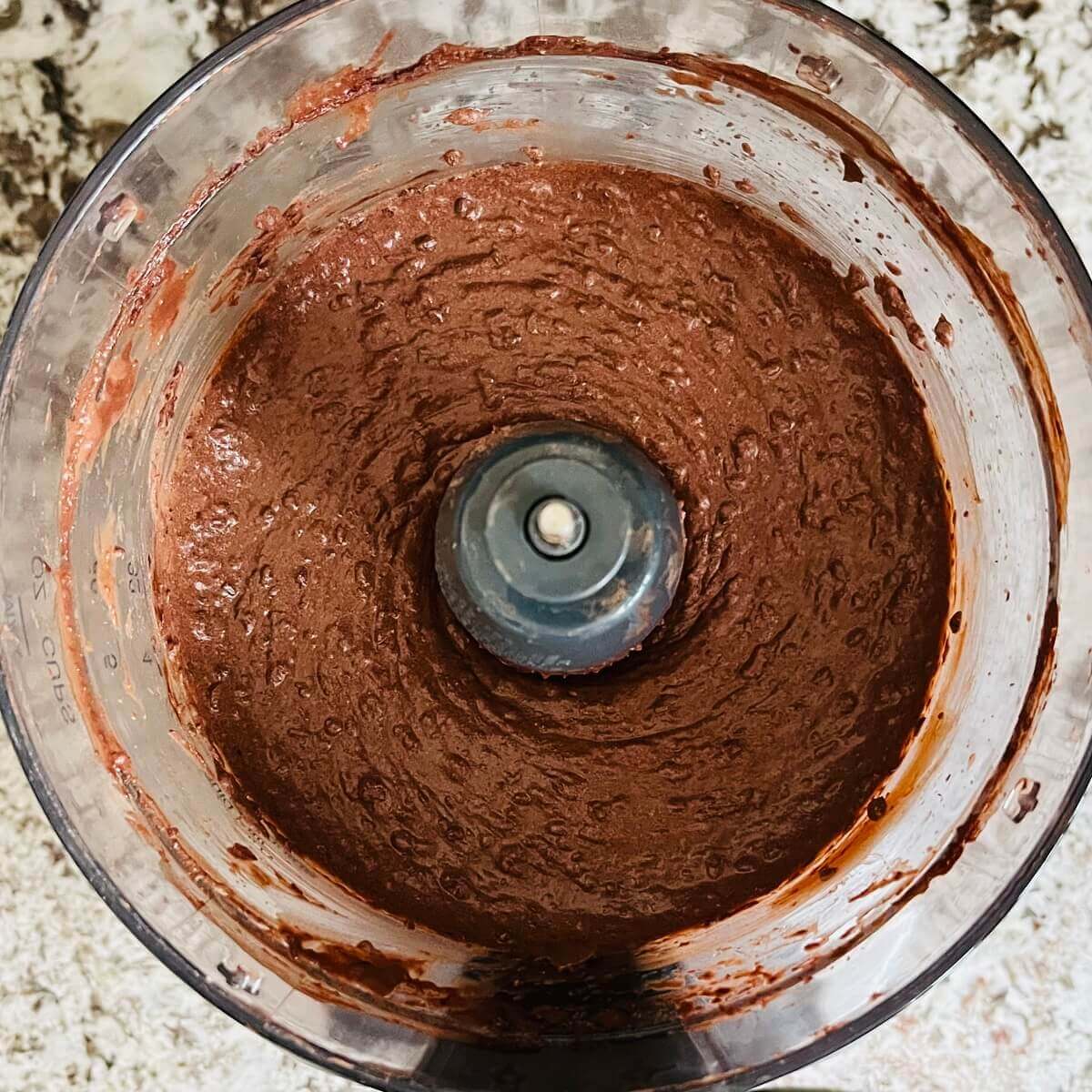 Ingredients for chocolate mousse blended in a food processor.