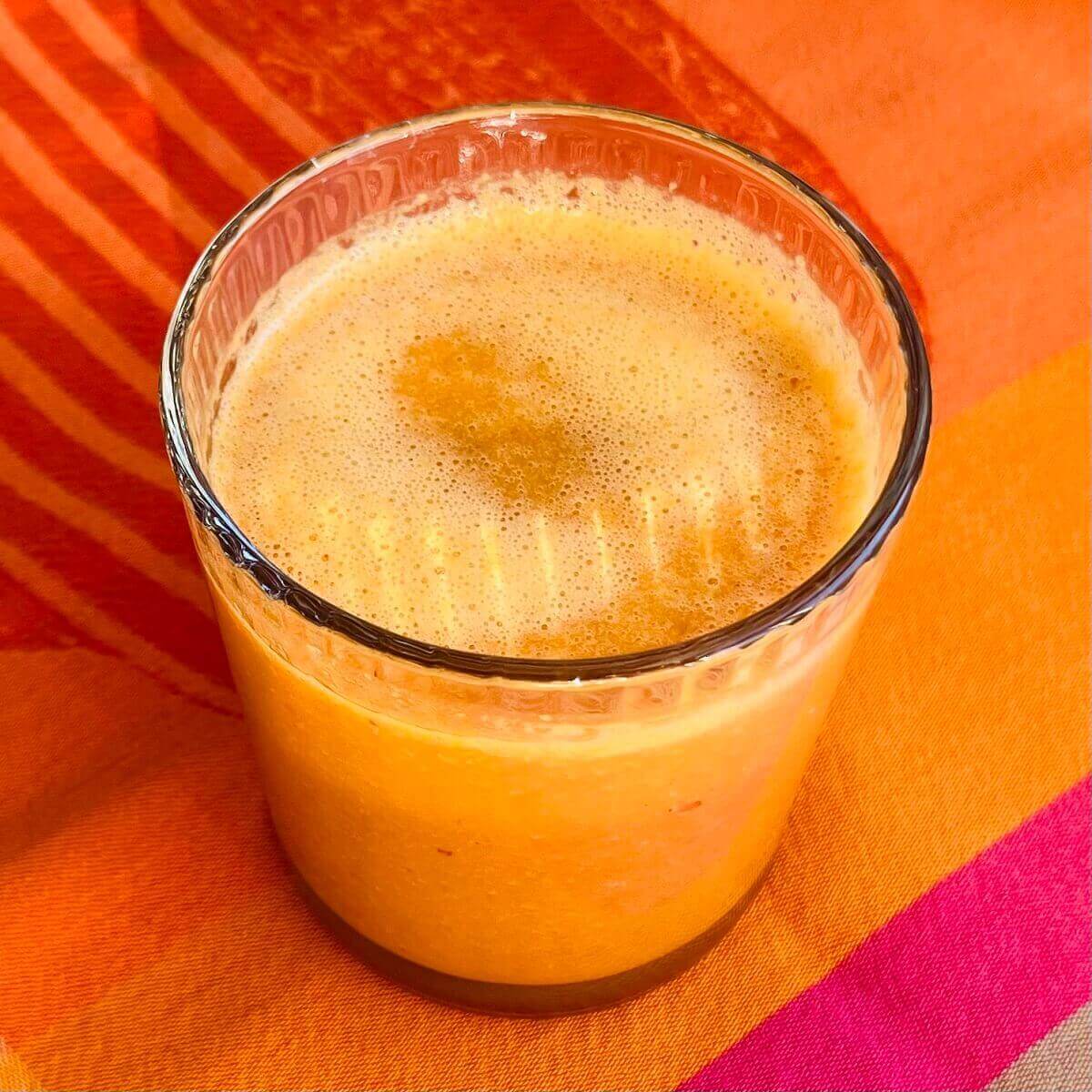 A glass of carrot juice smoothie.