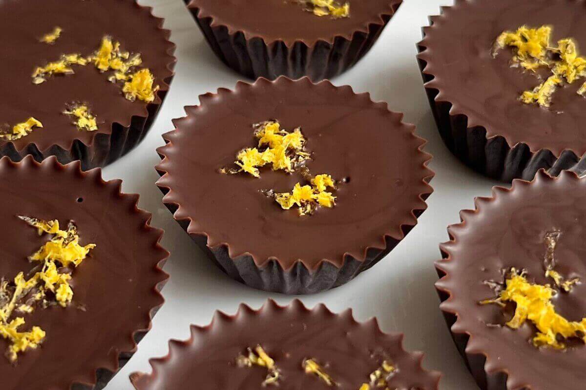 Lemon truffles on a white plate.