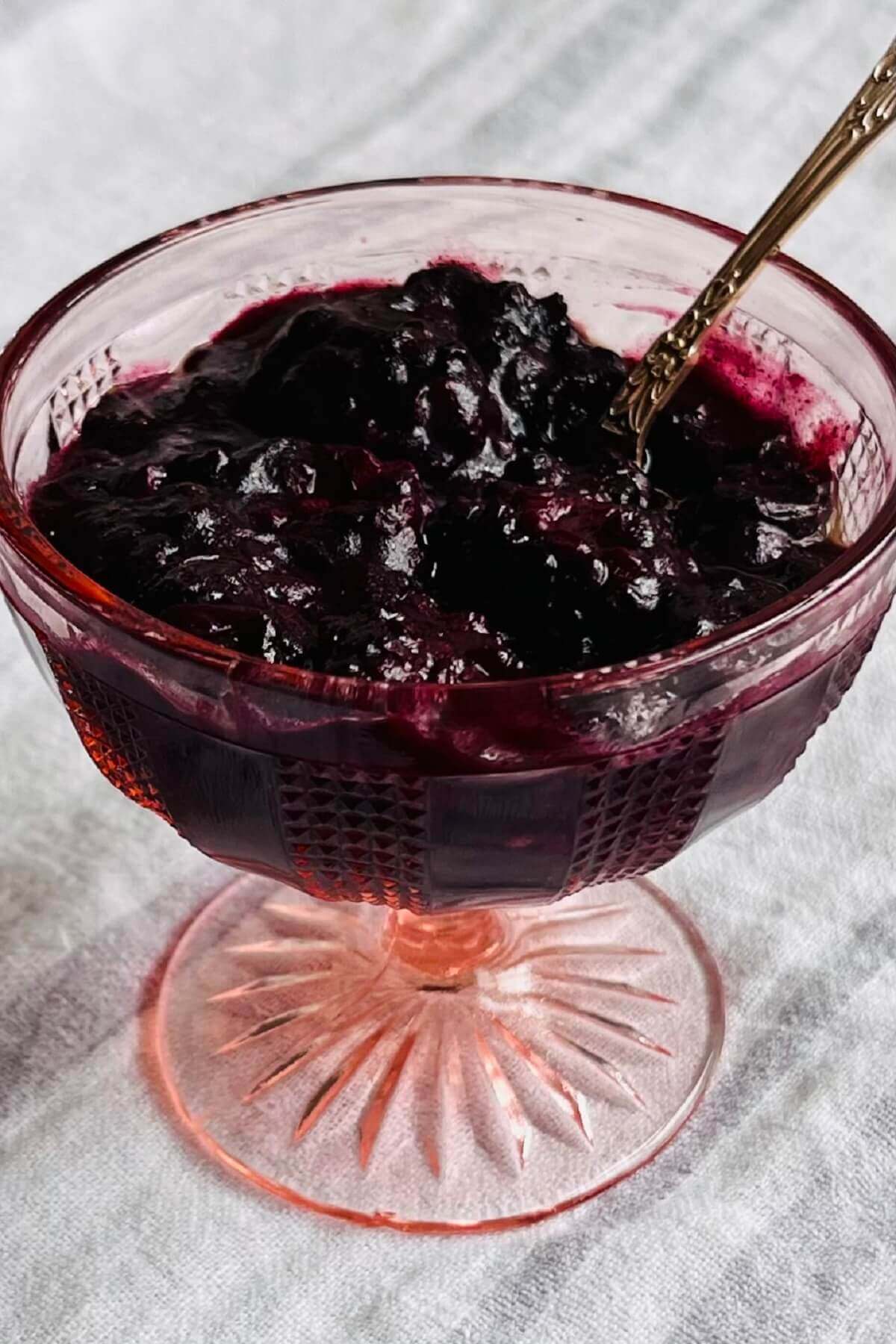 Roasted berries in a glass dish.