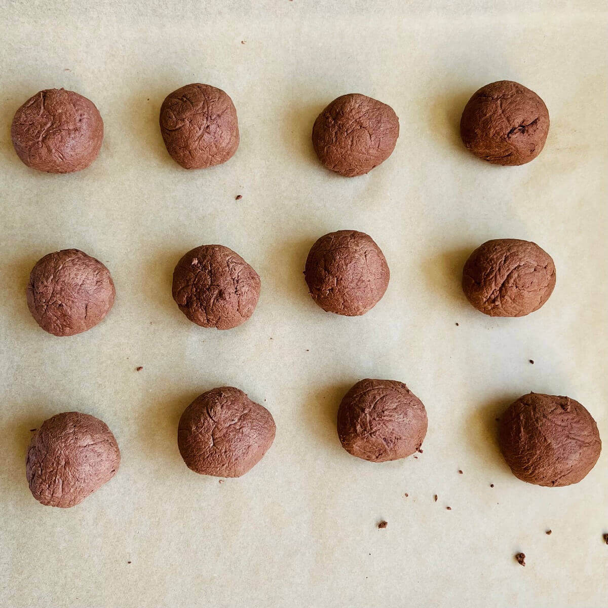Sweet potato chocolate balls on parchment paper.