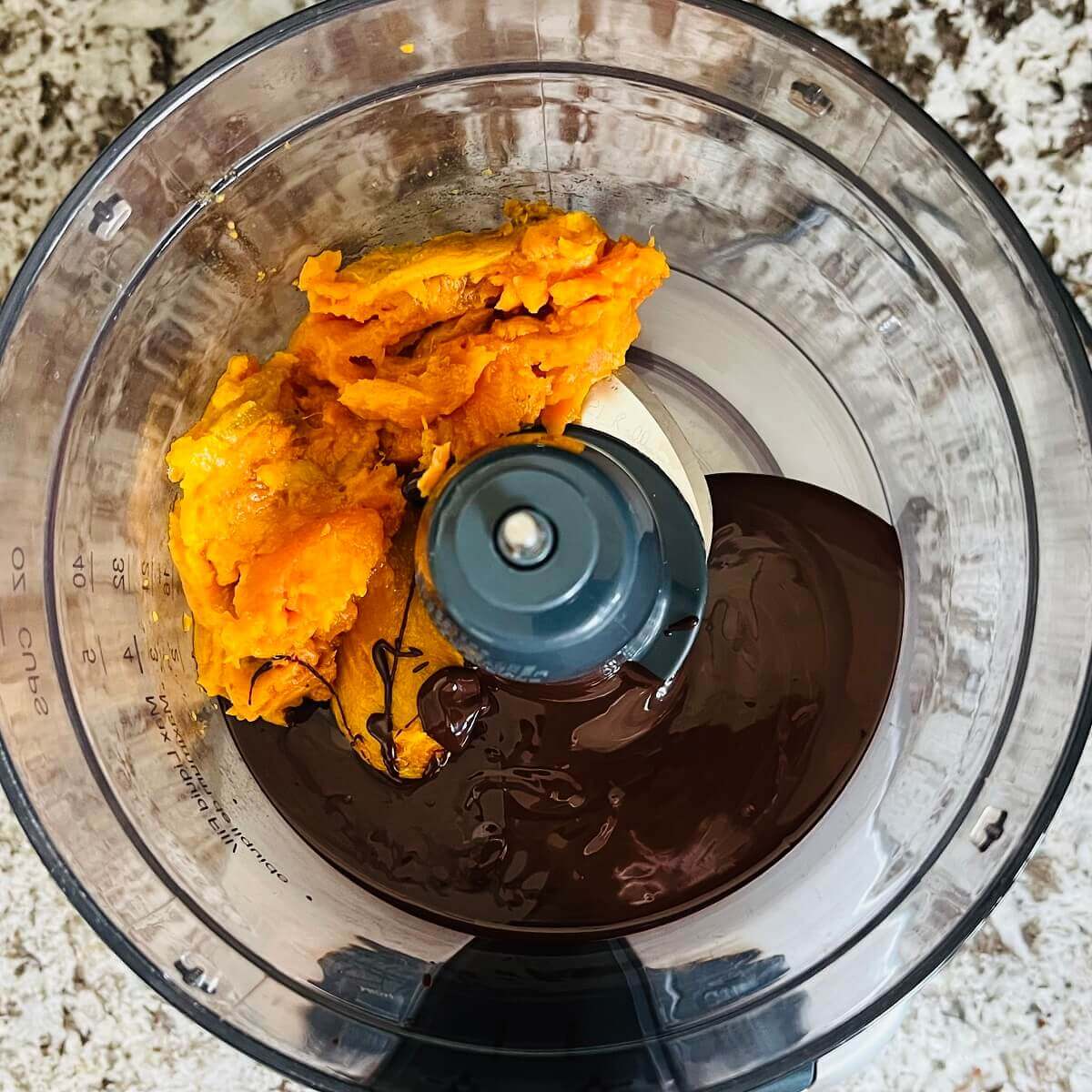 Baked sweet potato and melted chocolate in a food processor.