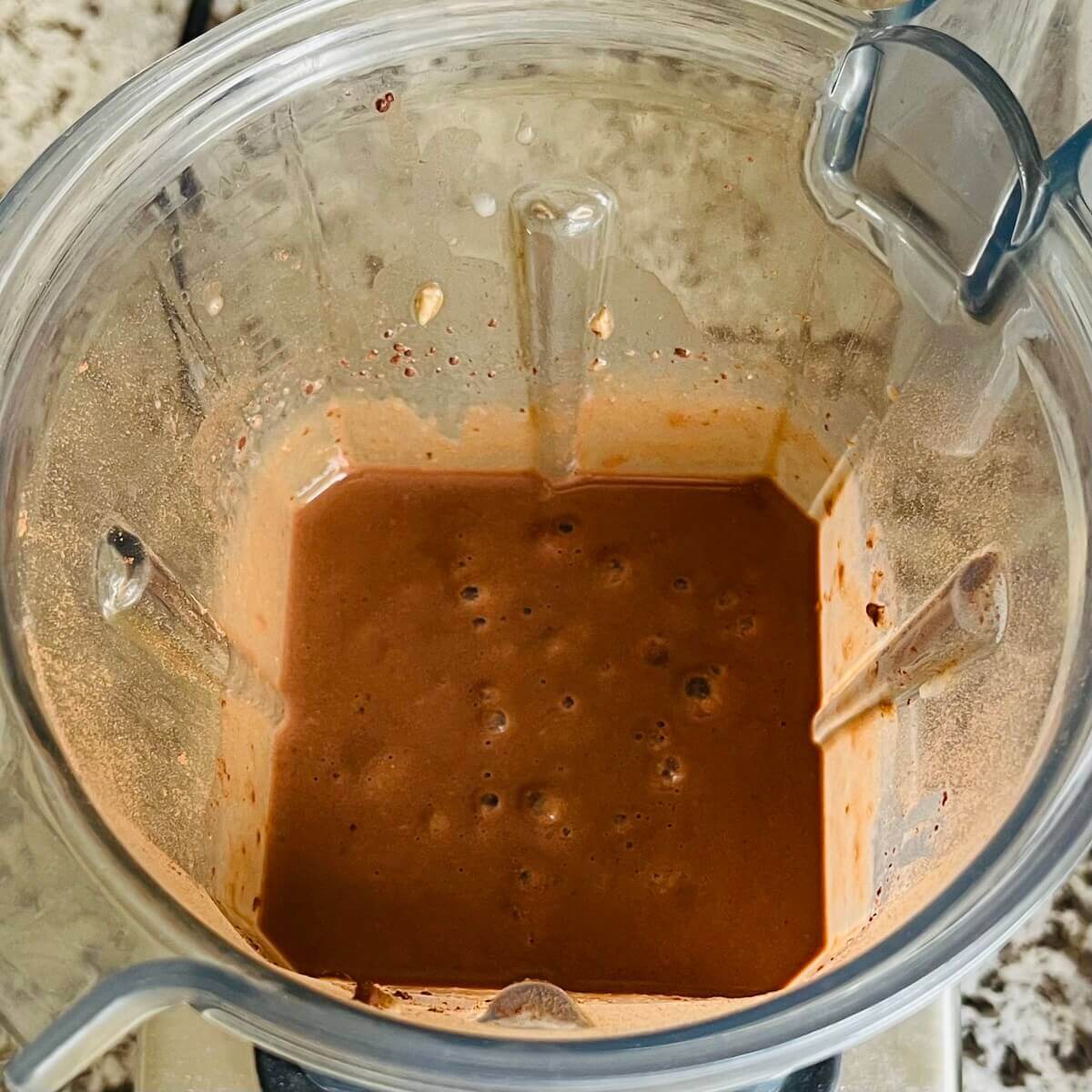 A creamy smoothie made with sunflower seeds blended in a blender.