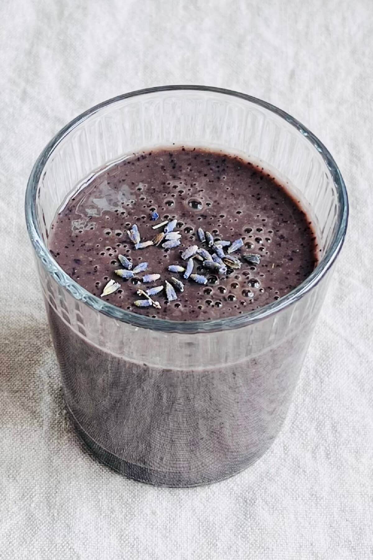 A smoothie made with lavender in a glass.