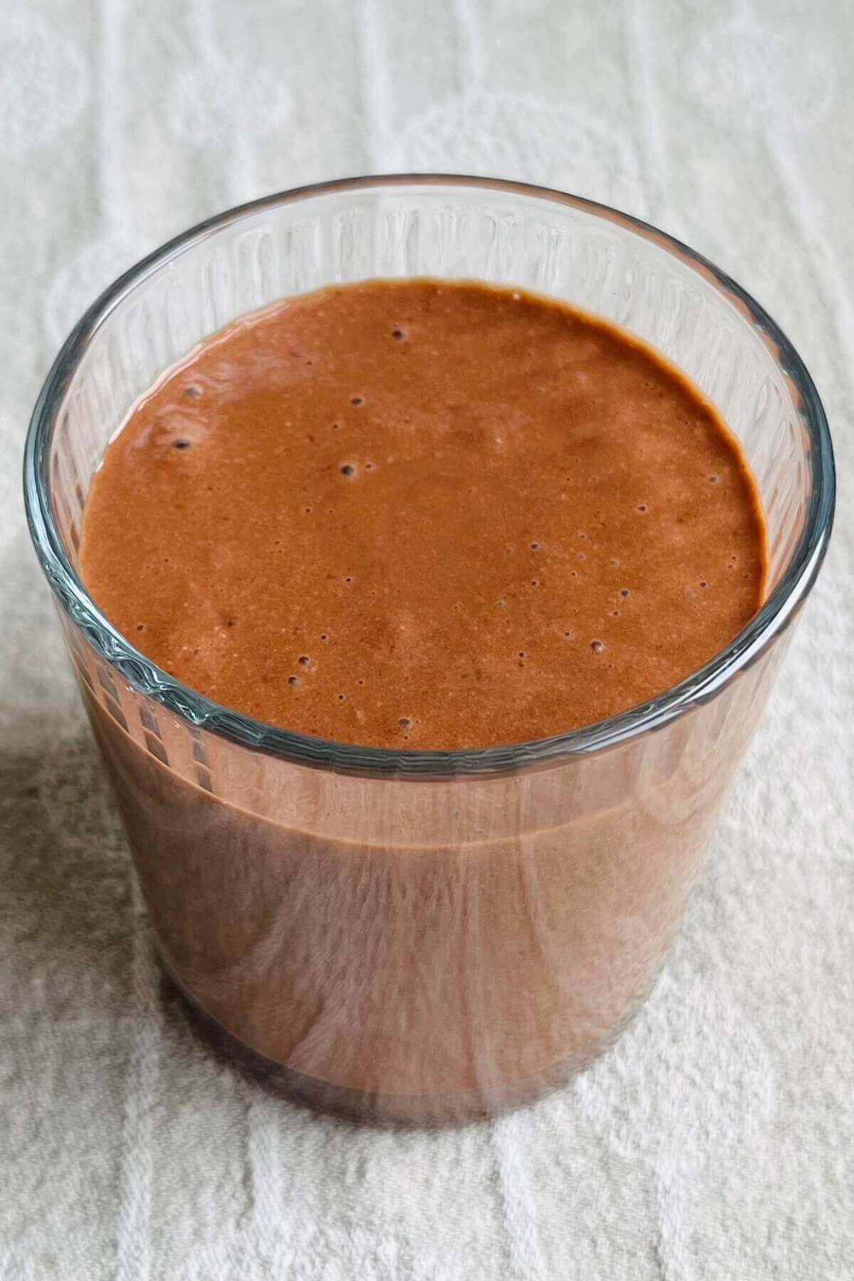 A sunflower seed chocolate smoothie in a glass.
