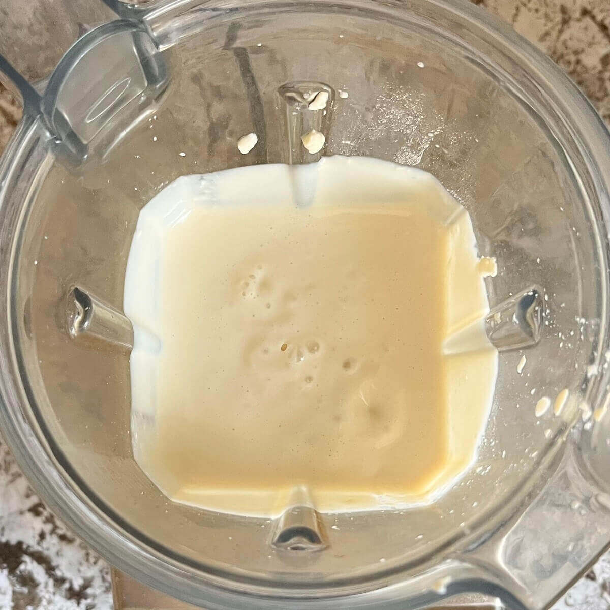Liquid blended mozzarella in a blender.