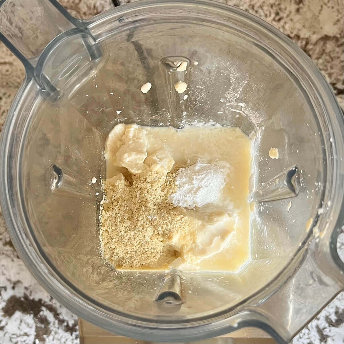 Ingredients for vegan mozzarella in a blender.