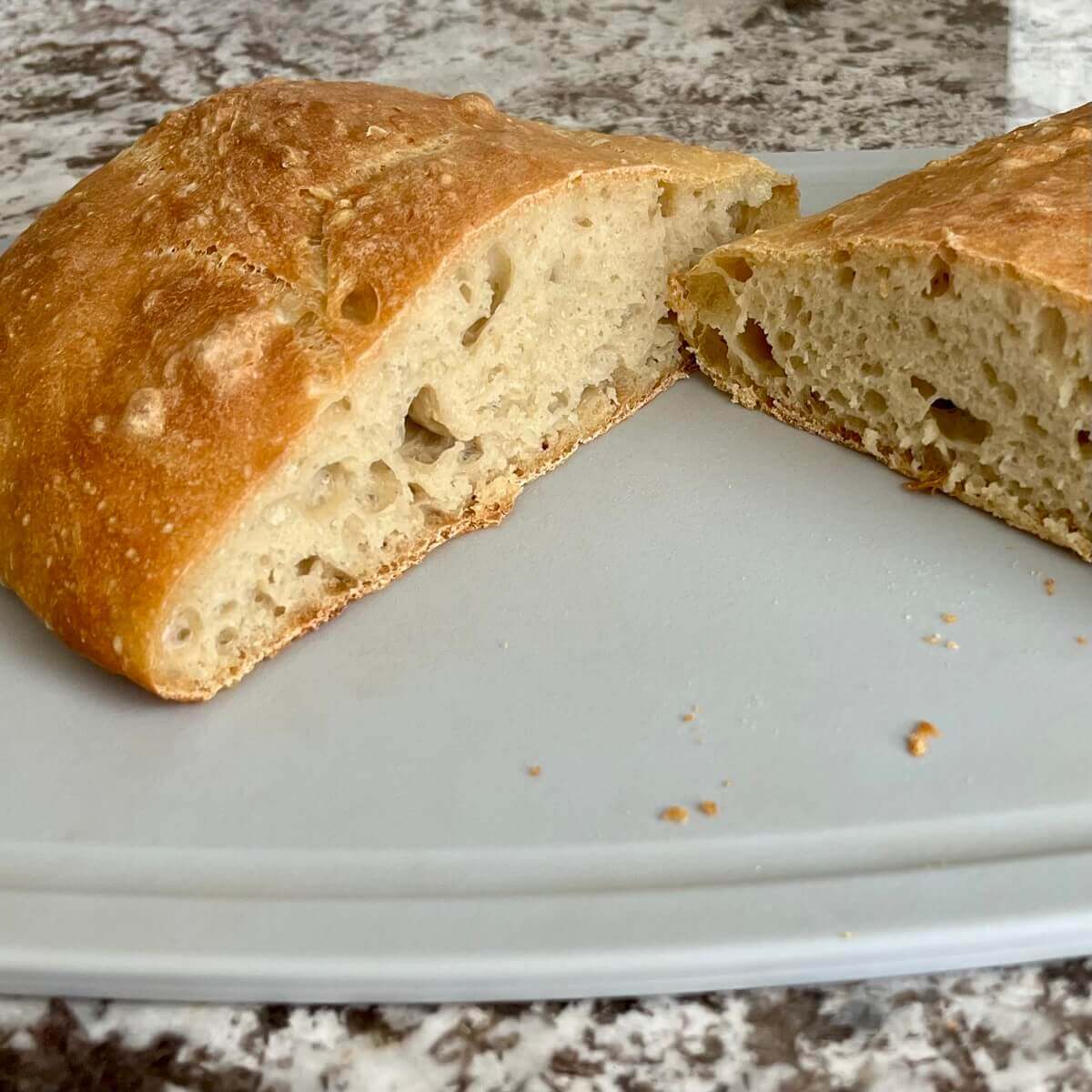 Artisan bread loaf cut in half.