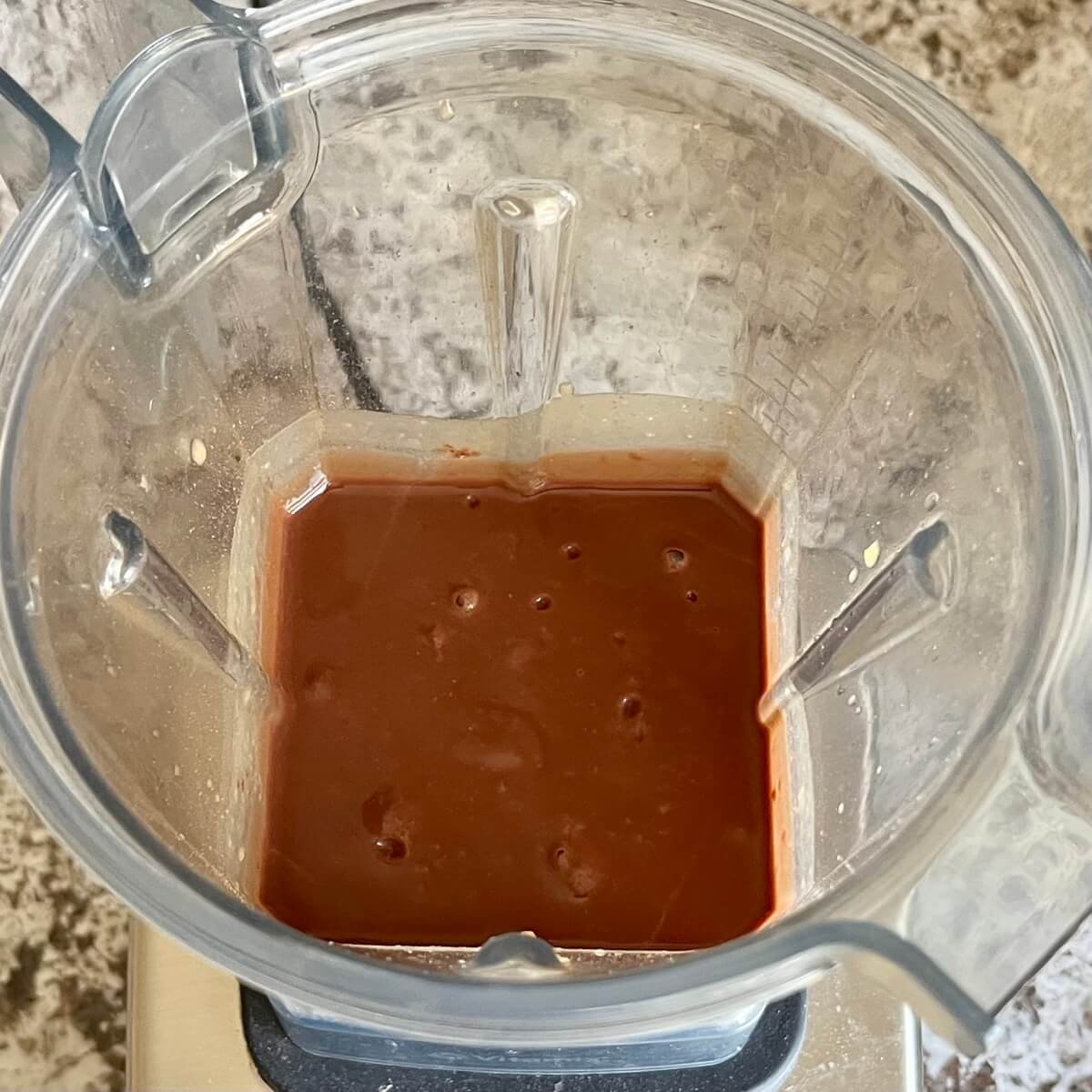 Lentils, maple syrup, water, and cocoa powder blended in a blender.