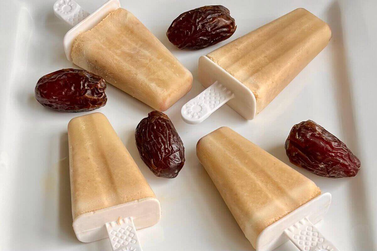 Popsicles and Medjool dates on a platter.