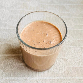 A creamy hazelnut smoothie in a glass.