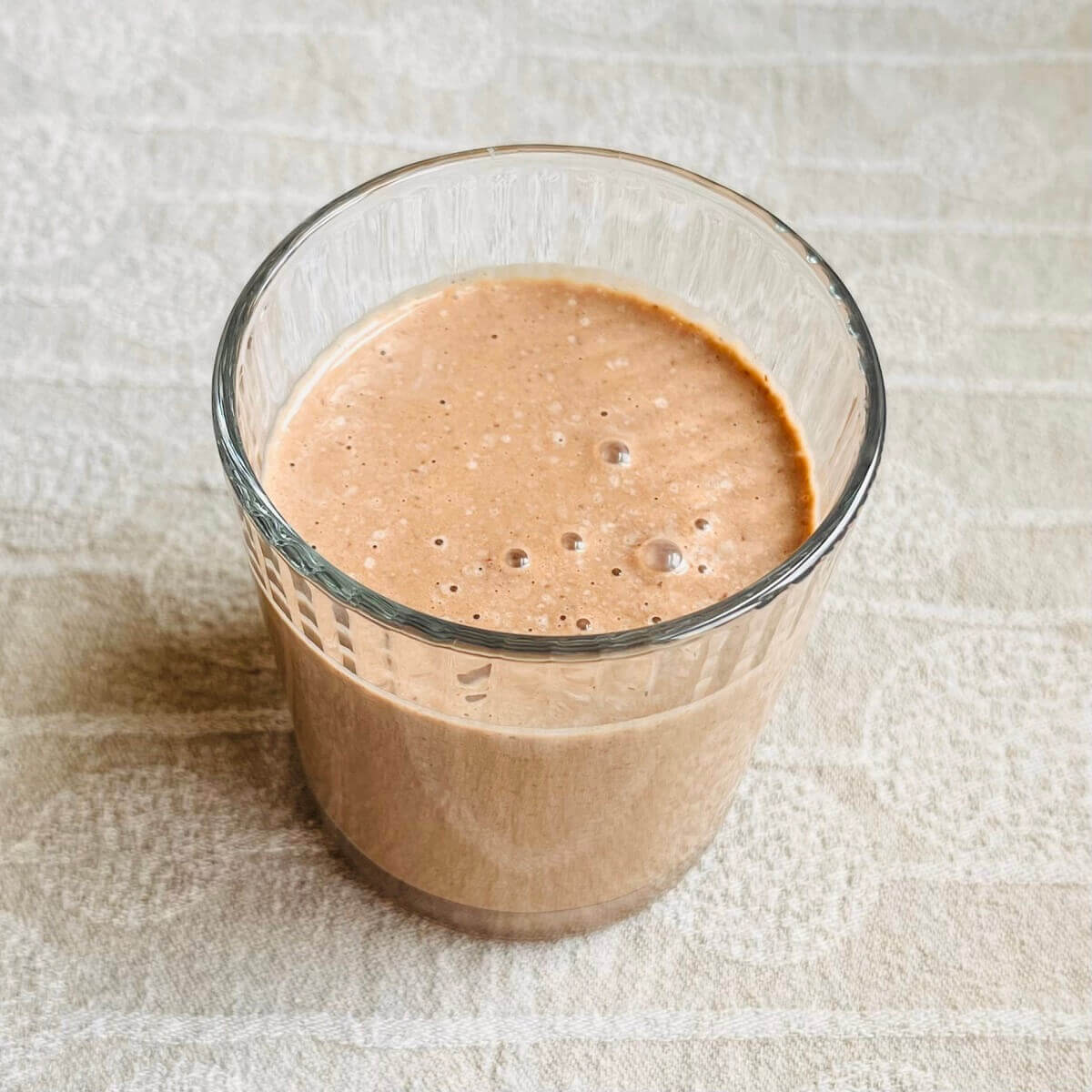 A creamy hazelnut smoothie in a glass.