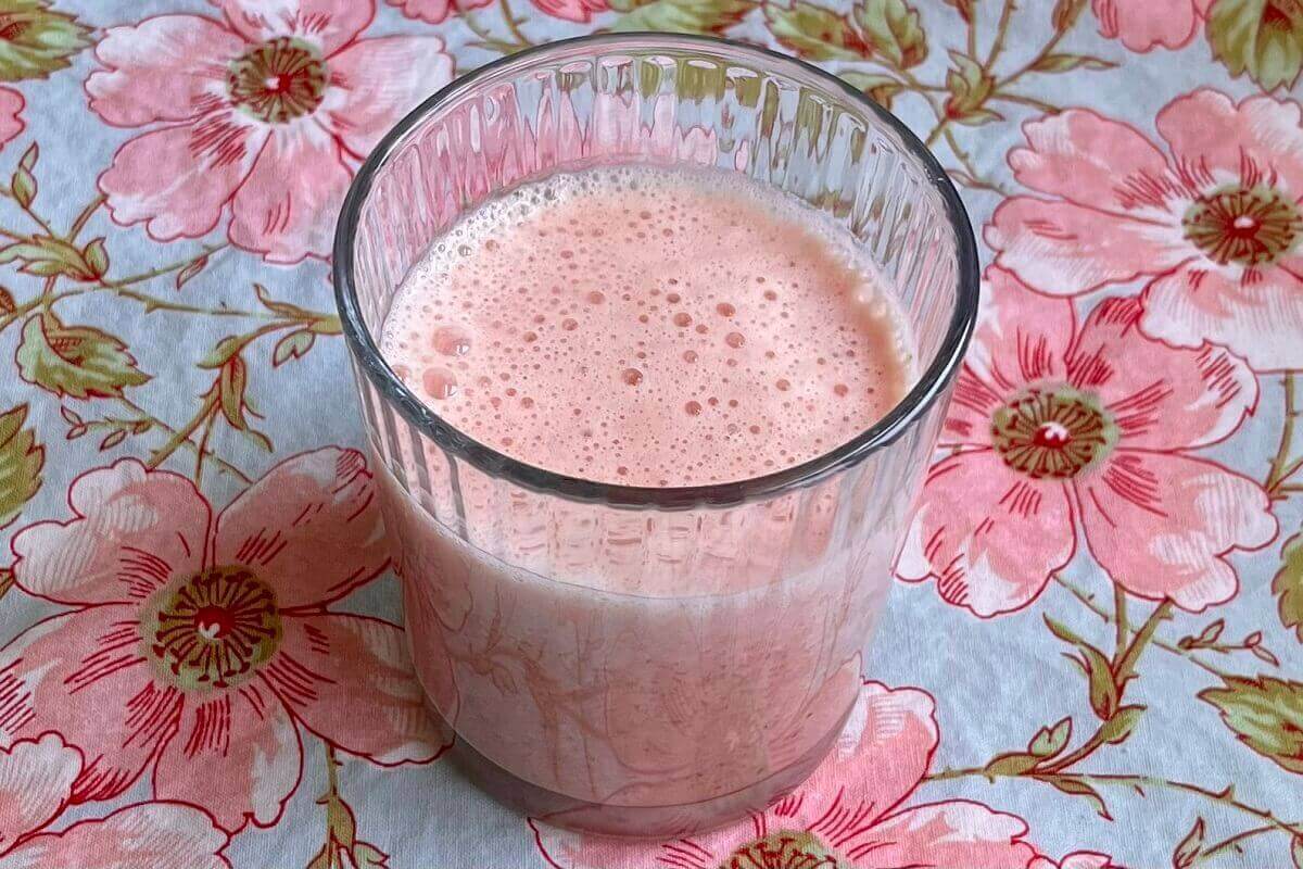 A watermelon lime shake in a glass.