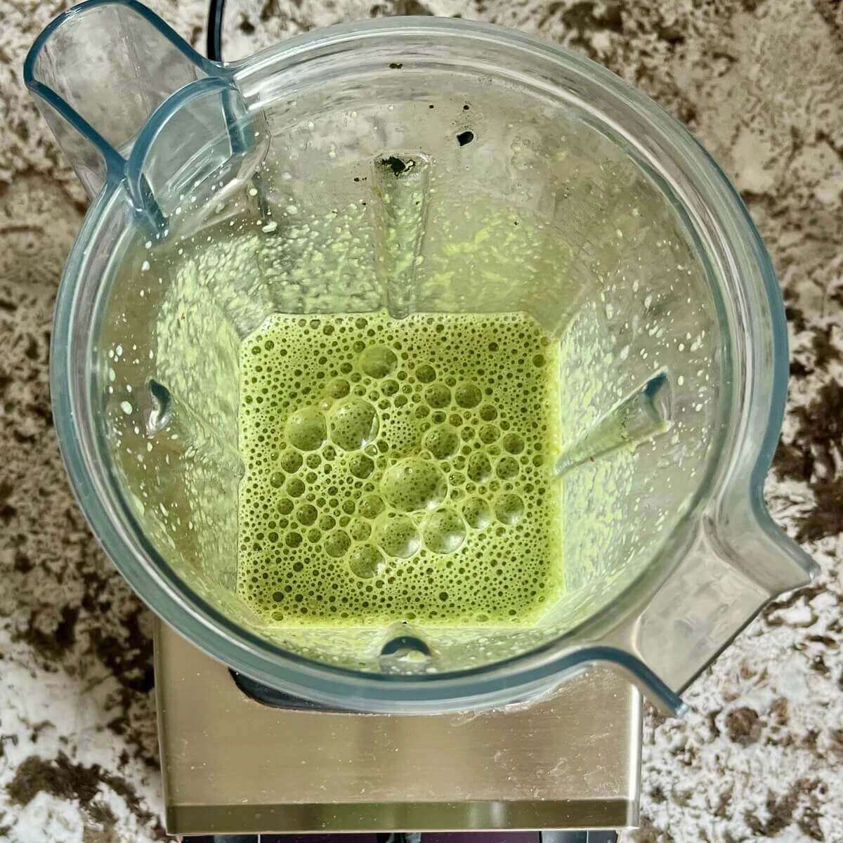 Chlorella and other smoothie ingredients blended in a blender.