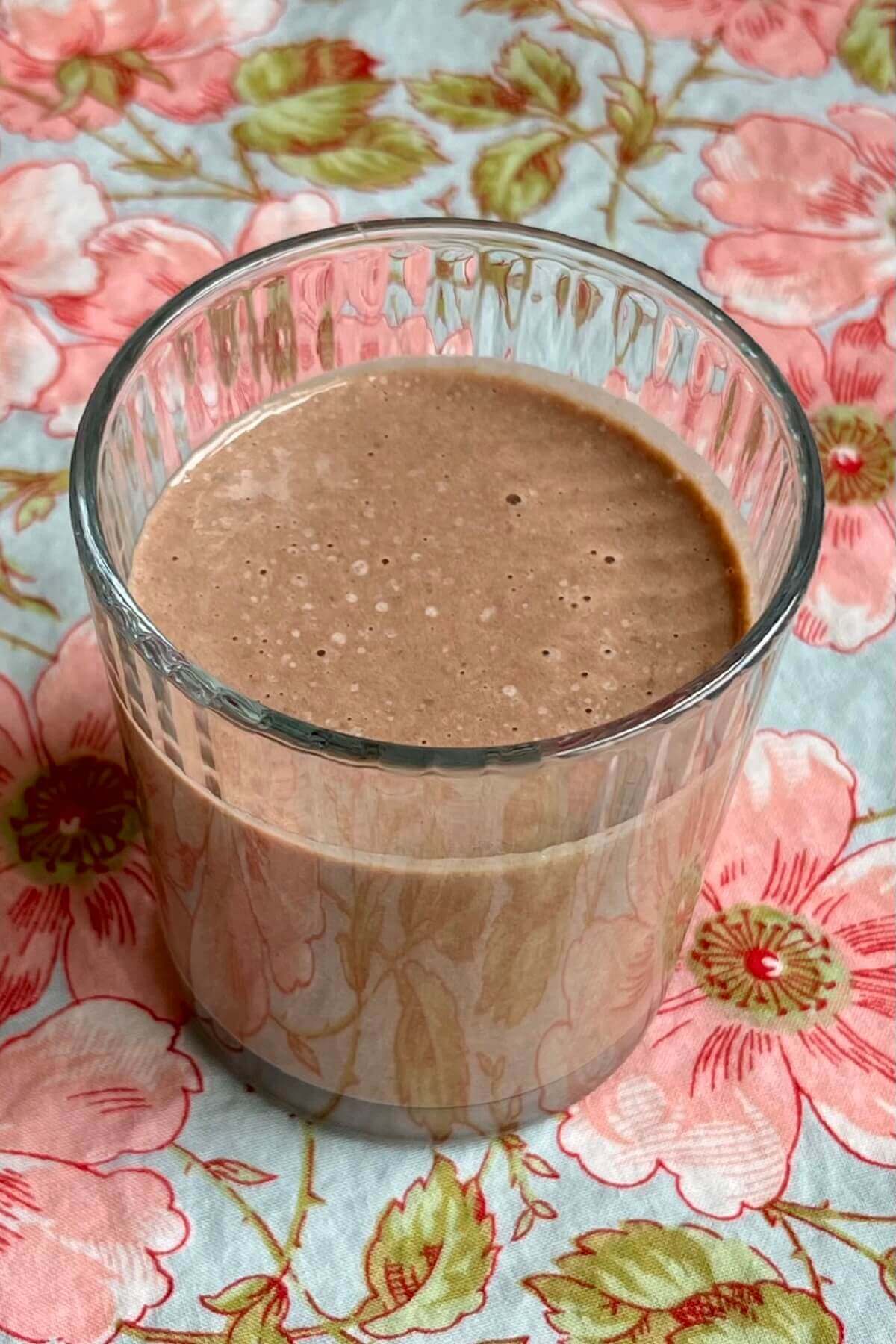 A creamy smoothie made with pumpkin seeds in a glass.