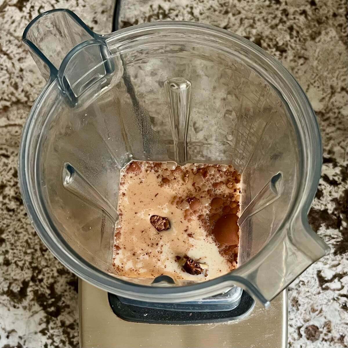 Tahini, cocoa powder, dates, soy milk, and sea salt in a blender.