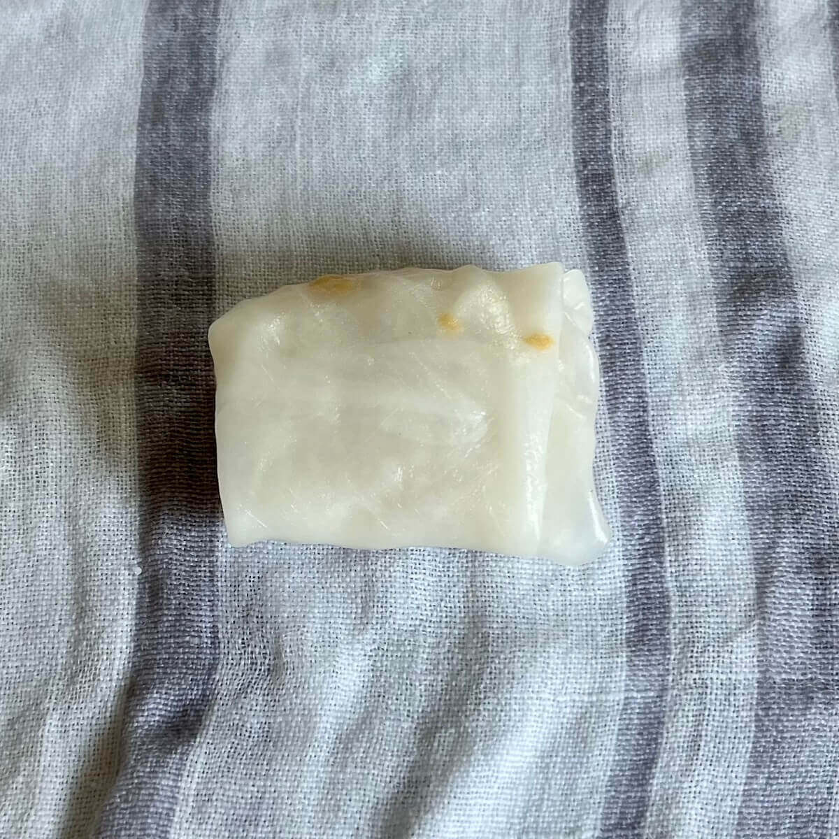 A dumpling on a damp kitchen towel.