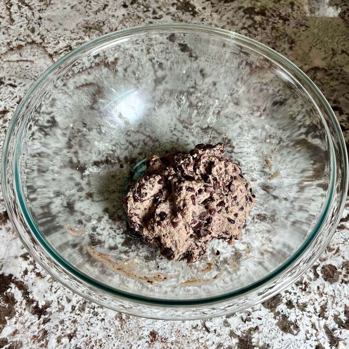 Vegan burger meat in a glass mixing bowl.