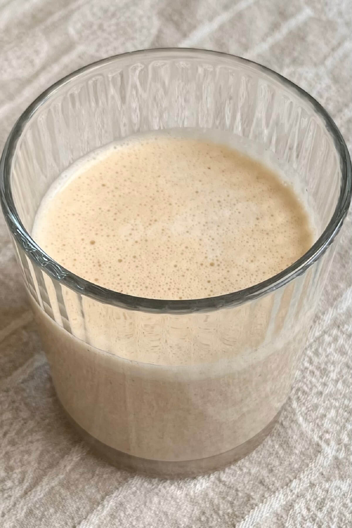 A caramel sea salt smoothie in a ribbed glass.