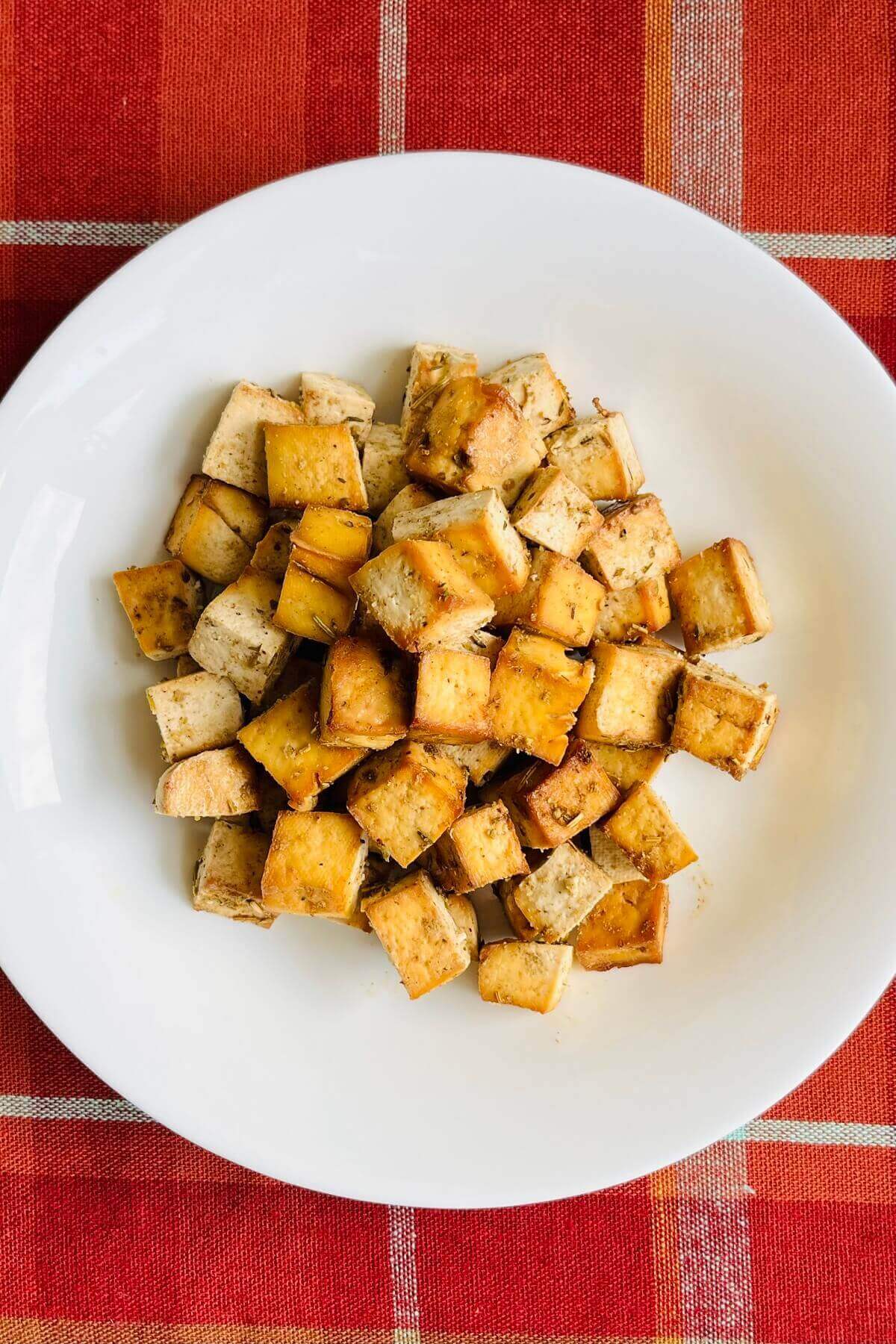 Tofu cubes in a white bowl.