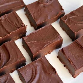 Portions of almond butter fudge on a plate.