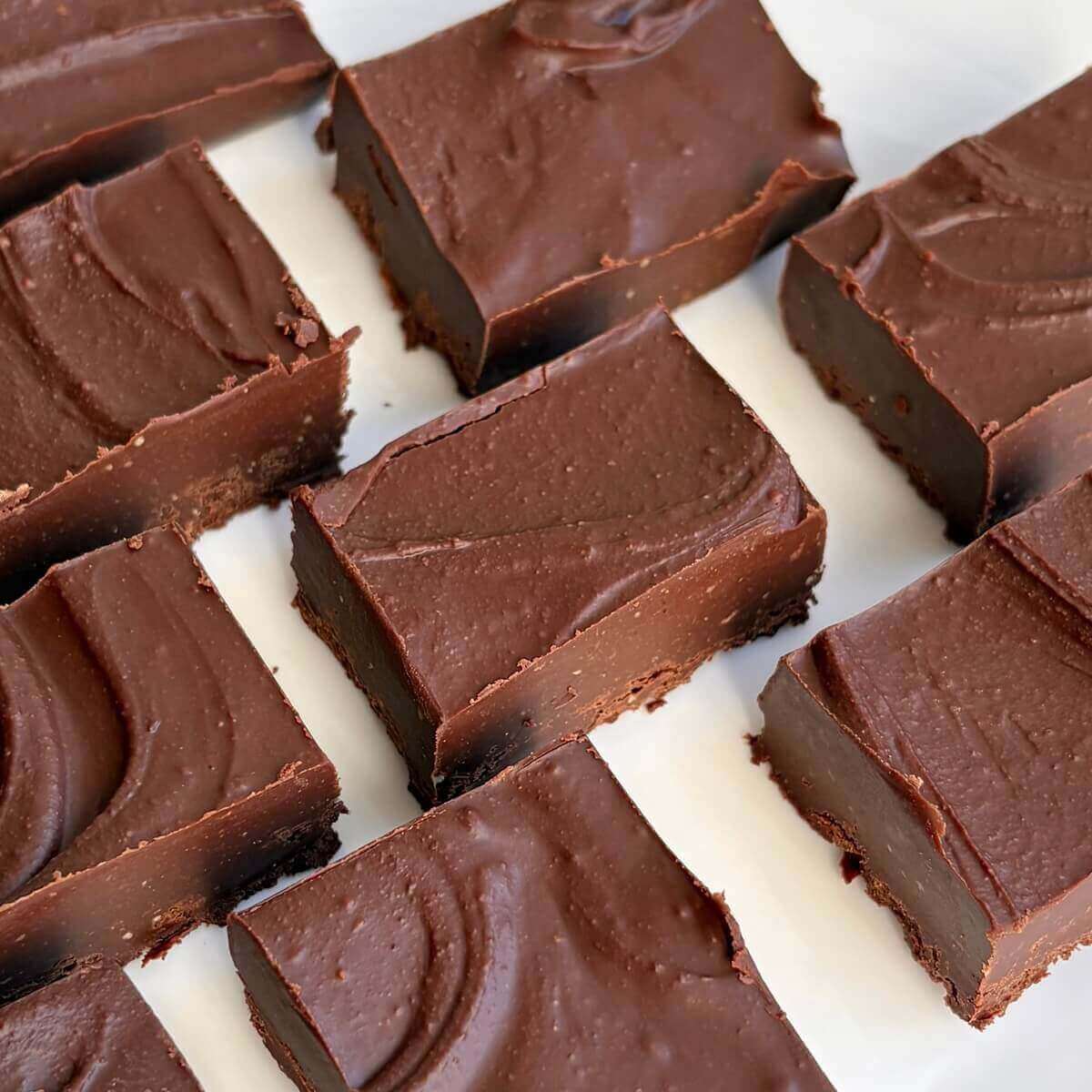 Portions of almond butter fudge on a plate.