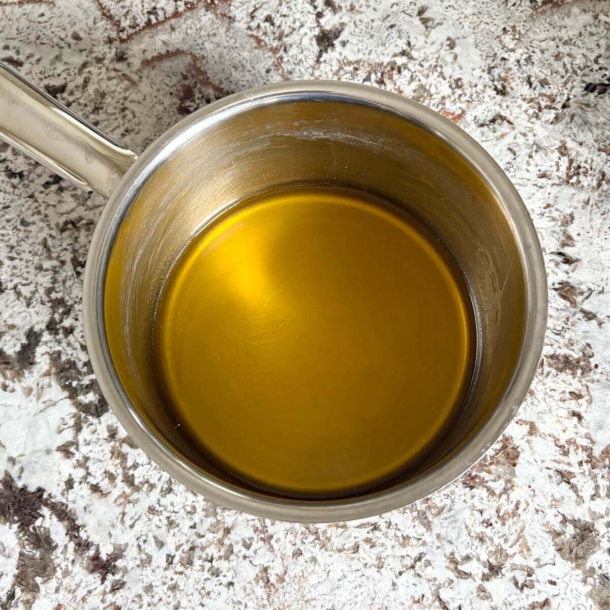 Melted cocoa butter in a pan.